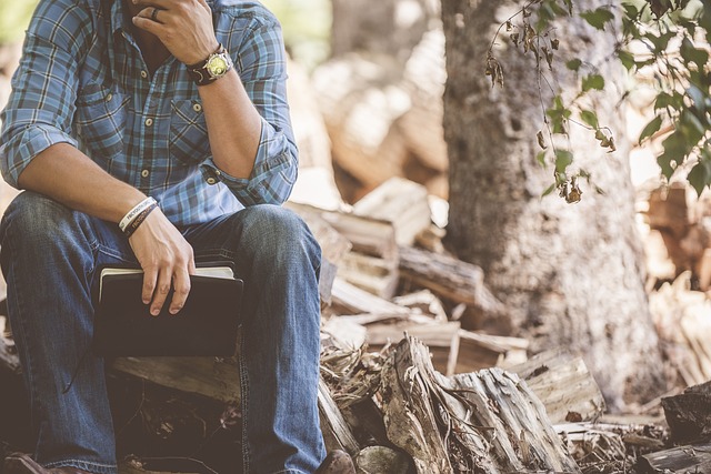 Man finding peace in nature, as if reflecting on healing from childhood sexual abuse